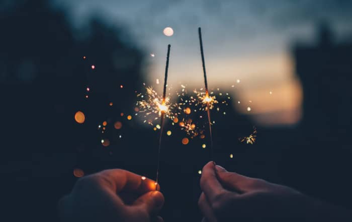 person holding sparklers