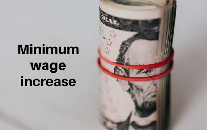 A roll of cash with a rubber band wrapped around it